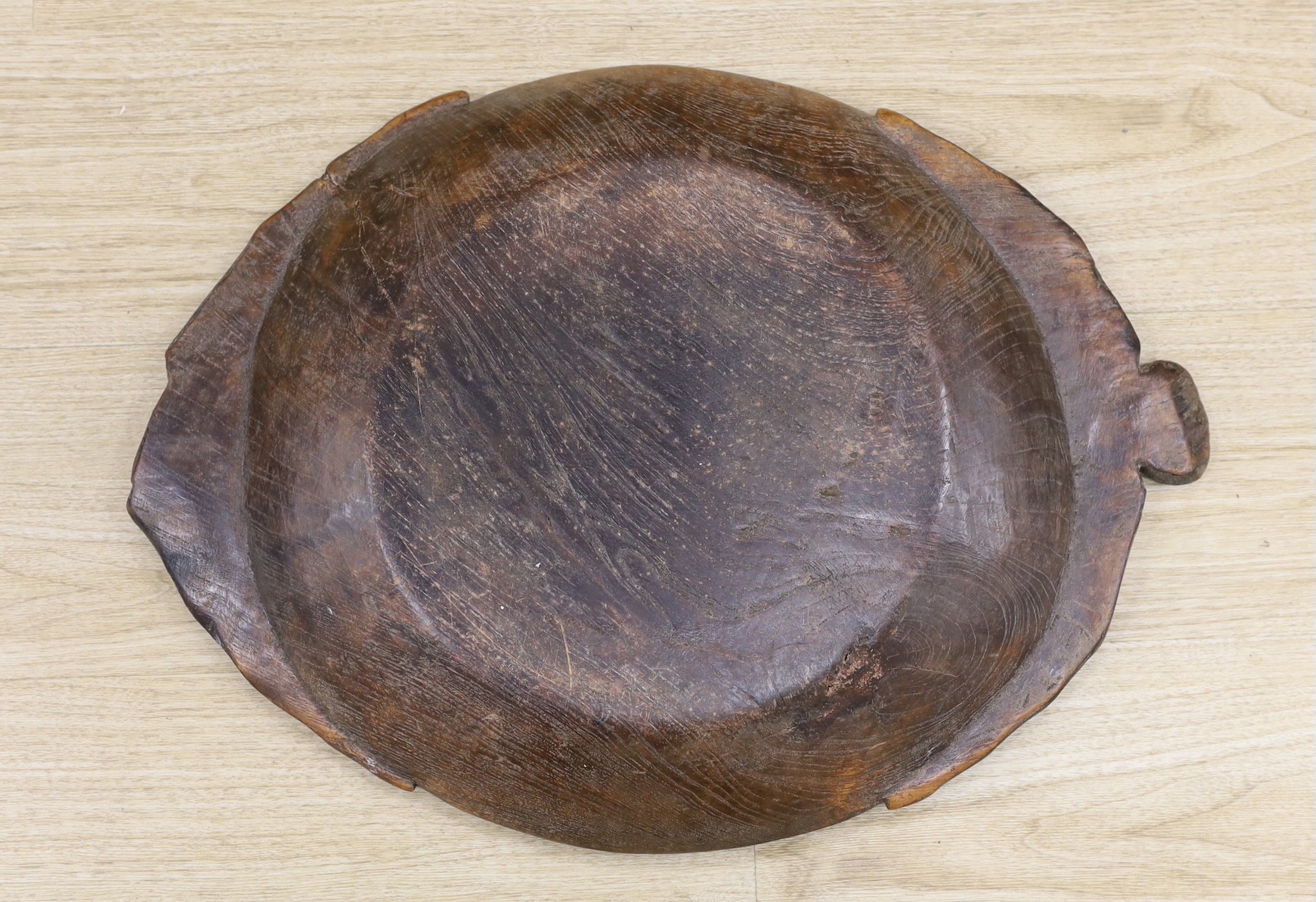 An 18th century/19th century provincial elm serving dish, 58 cms wide